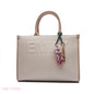 EMBOSSED LOGO TOTE BAG WITH TASSEL CHARM - LARGE
